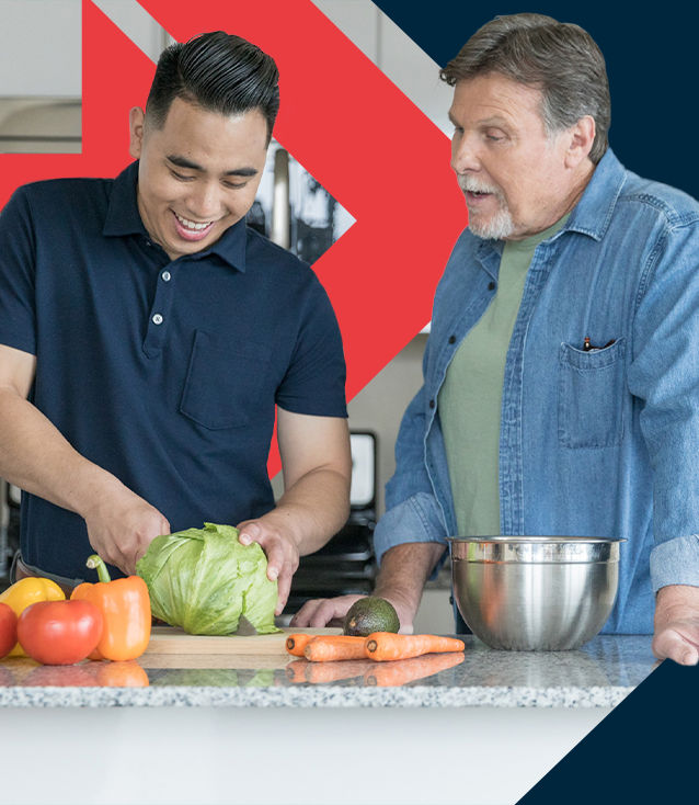 ACE Fitness Nutrition Specialist teaching a client about healthy eating while preparing vegetables in the kitchen