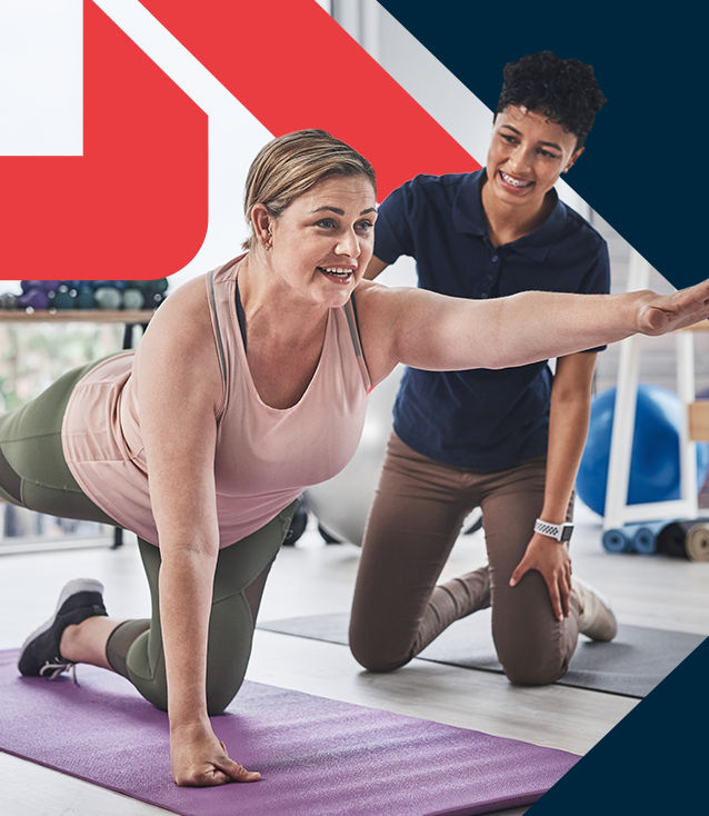 ACE Pain-Free Movement Specialist guiding a client through the proper form for a balancing exercise