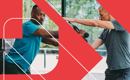 ACE Corrective Exercise Specialist coaching a client through a cable rope pull to improve functional strength and mobility